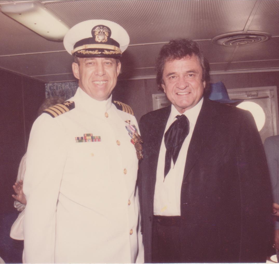The coauthor, Captain Roy “Outlaw” Cash, Jr., USN, with the “Man in Black,” uncle J.R. “Johnny” Cash, on board USS El Paso (LKA-117) in 1987 (Courtesy, Cash Family)