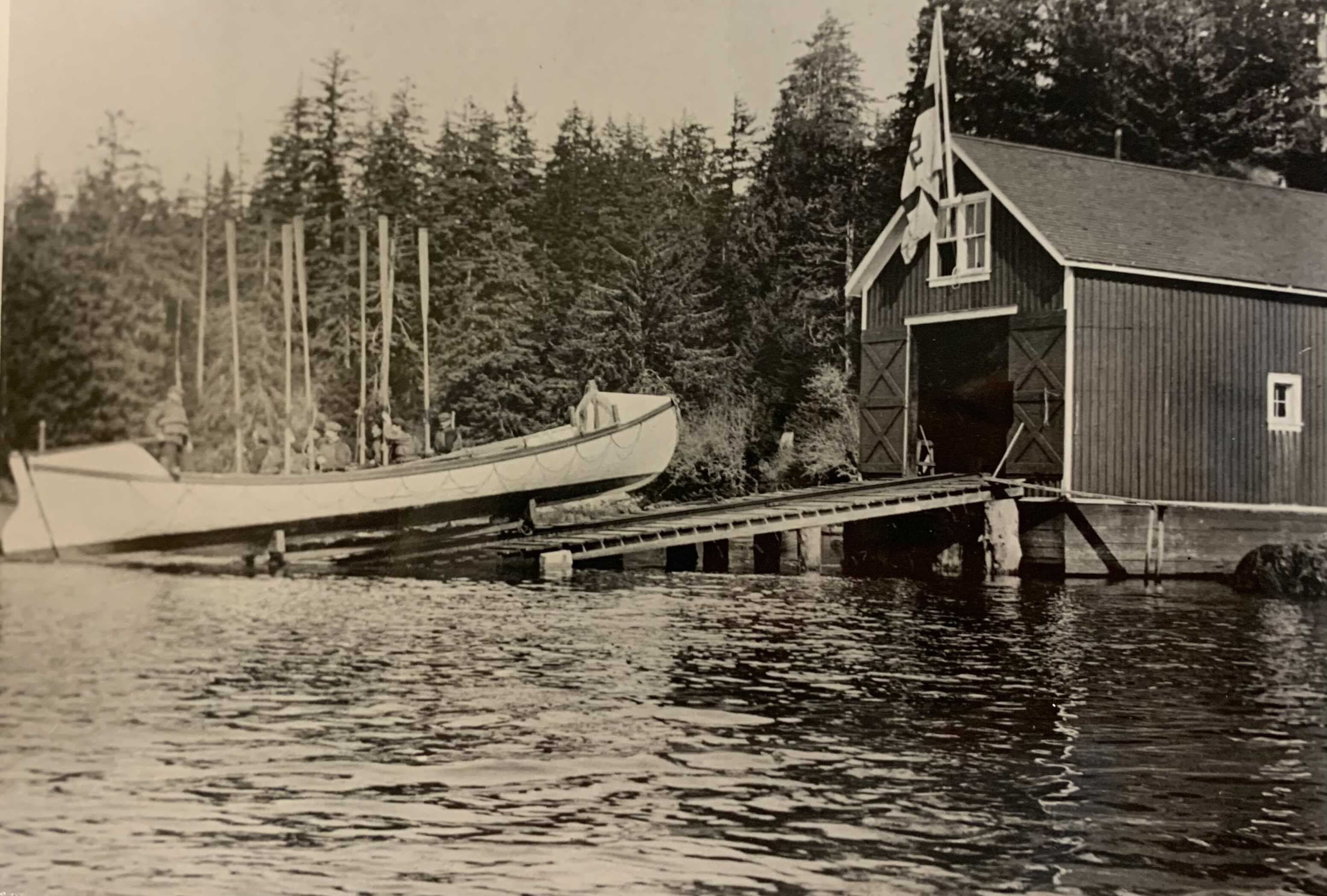 A photo of the Ucluelet Life Saving Station, crew, and boat circa 1935.