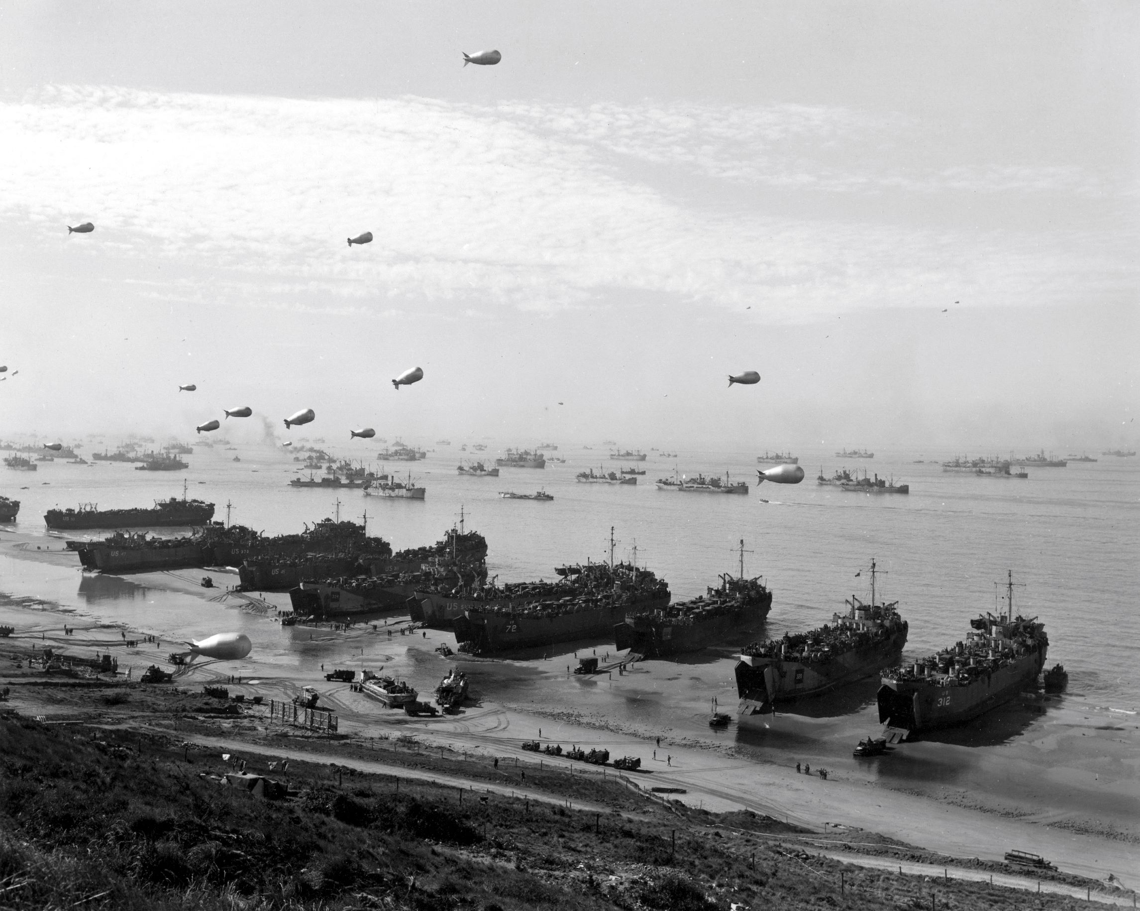 British and American LSTs offloading directly on Omaha Beach, on or after 10 June 1944.